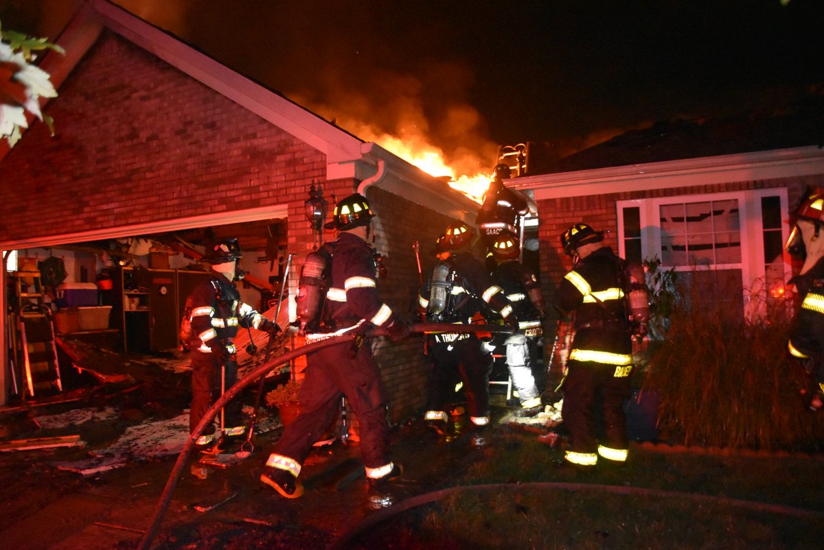 A firefighter was hospitalized for possible heat exhaustion after a fire broke out in a home and spread to two other homes on the city's southeast side Sunday morning