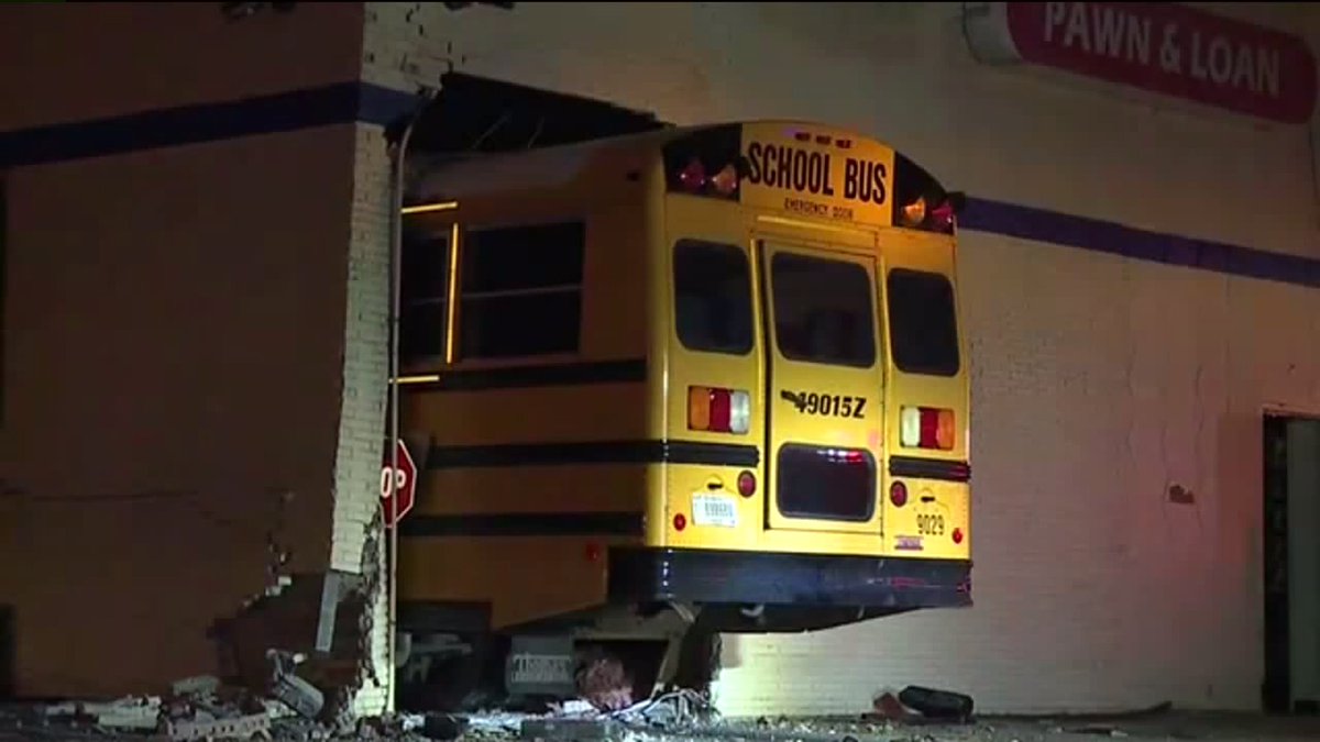 The school bus crashed all the way into a building on the east side at E 16th St and N Emerson Ave. A silver car was also involved in the crash