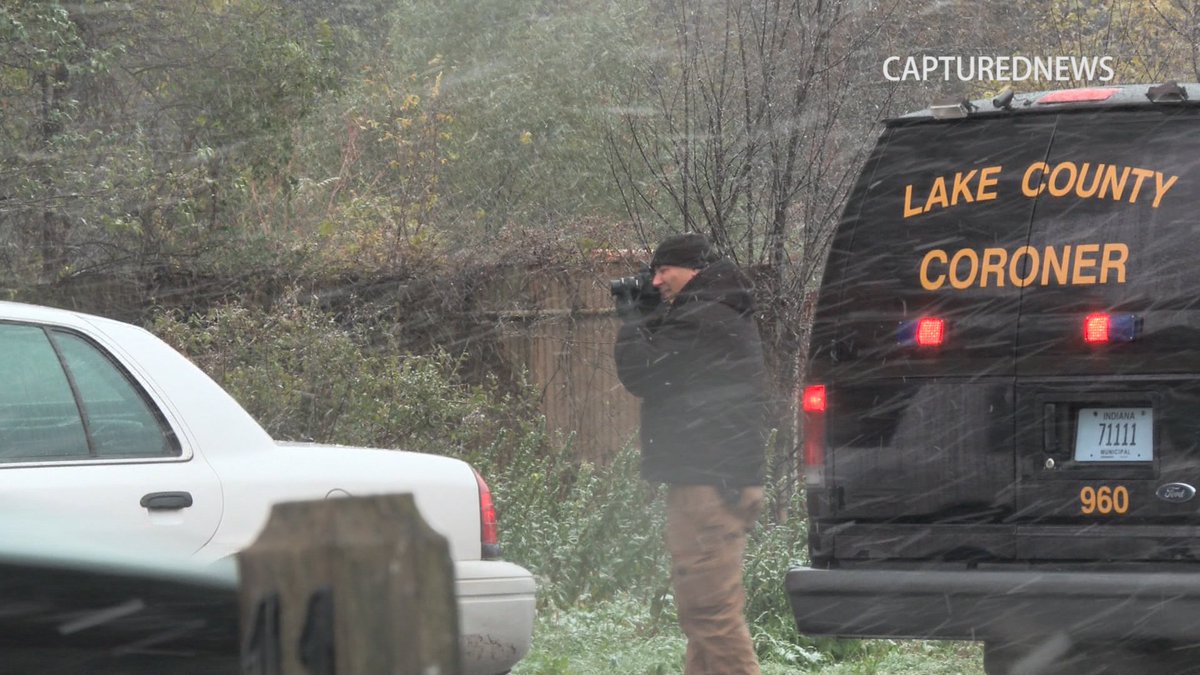 Gary Police along with the Lake County Coroner investigate a body that was discovered in a vacant lot