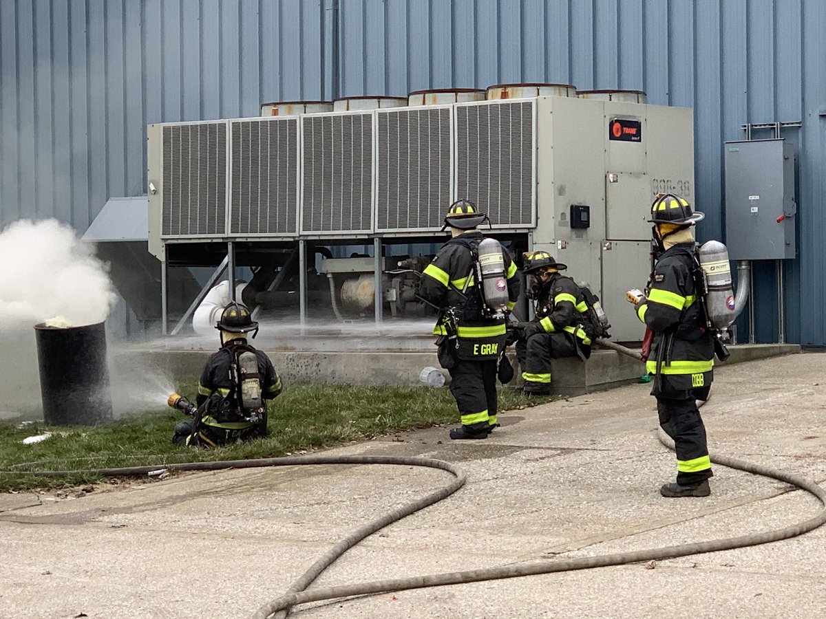 Firefighters use handline to cool outside of barrel containing epoxy as Haz Mat crews work with Major Tool personnel to mitigate chemical reaction.  12 students from nearby Zion Church preschool being relocated to IMPD site at 42nd & College.  No injuries