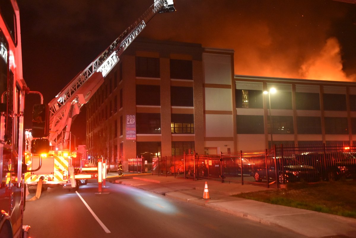 Over 100 evacuate after heavy fire breaks out on top of 800 Cap apartment building at 800 N Capitol Ave.  Blaze contained to 60 x 40 composite wood deck with  no extension.  Firefighters mark under control in 40 minutes with  use of aerial ladders & high rise packs for attack