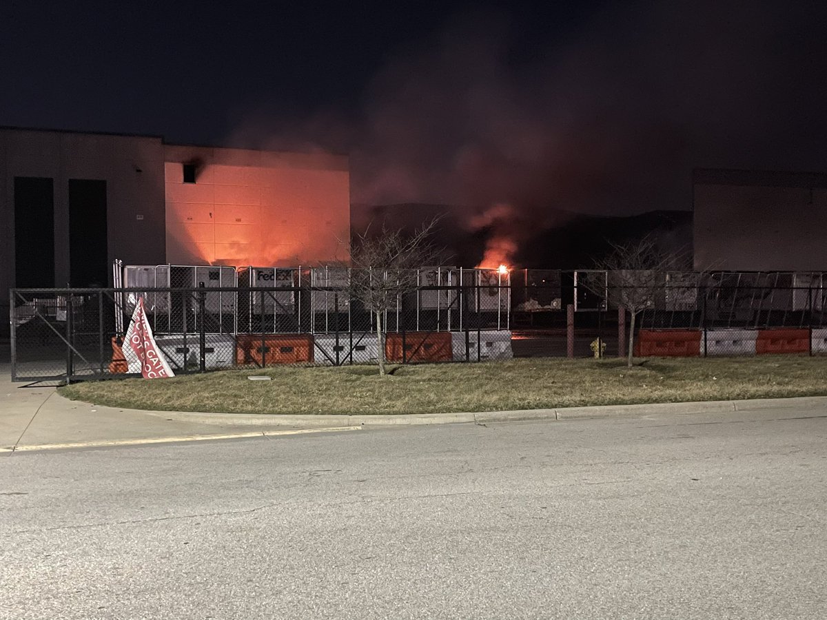 Walmart Distribution Center in Plainfield where flames can still be seen from the row of semis here.   Several agencies still on scene.