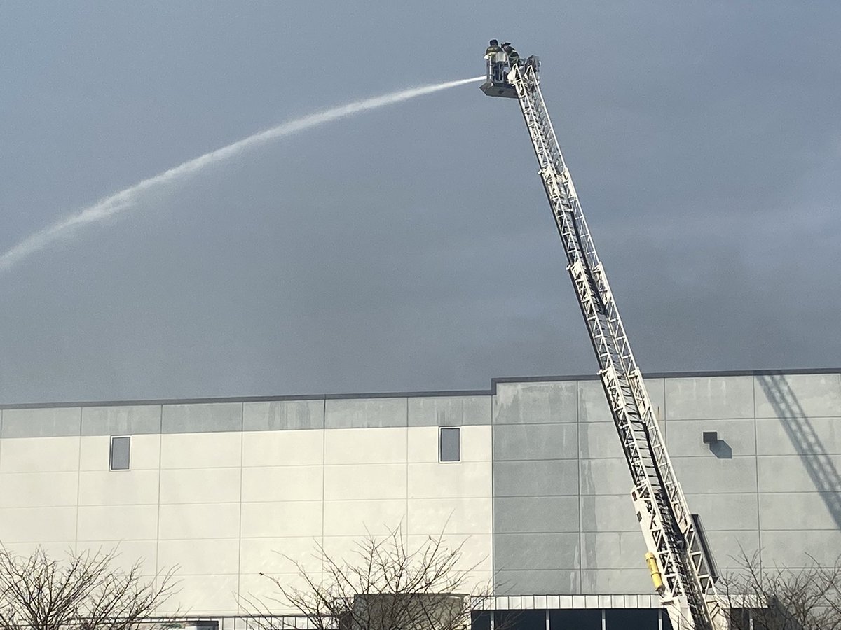 Nearly 24 hours after the call came in, firefighters are still working to put out the fire at the Walmart distribution center in Plainfield. The smell of smoke is heavy in the air as crews work