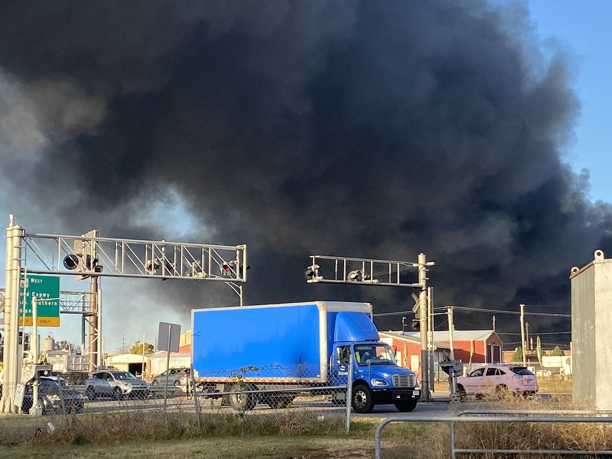 The warehouse fire on East Franklin continues to send a  plume into the sky