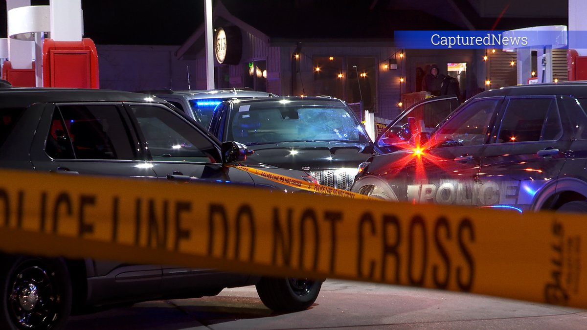 MUNSTER, IN: Police are investigating a shooting at a gas station near Ridge & Manor. Crime scene tape is stretched around the station. Police have an SUV boxed in. 