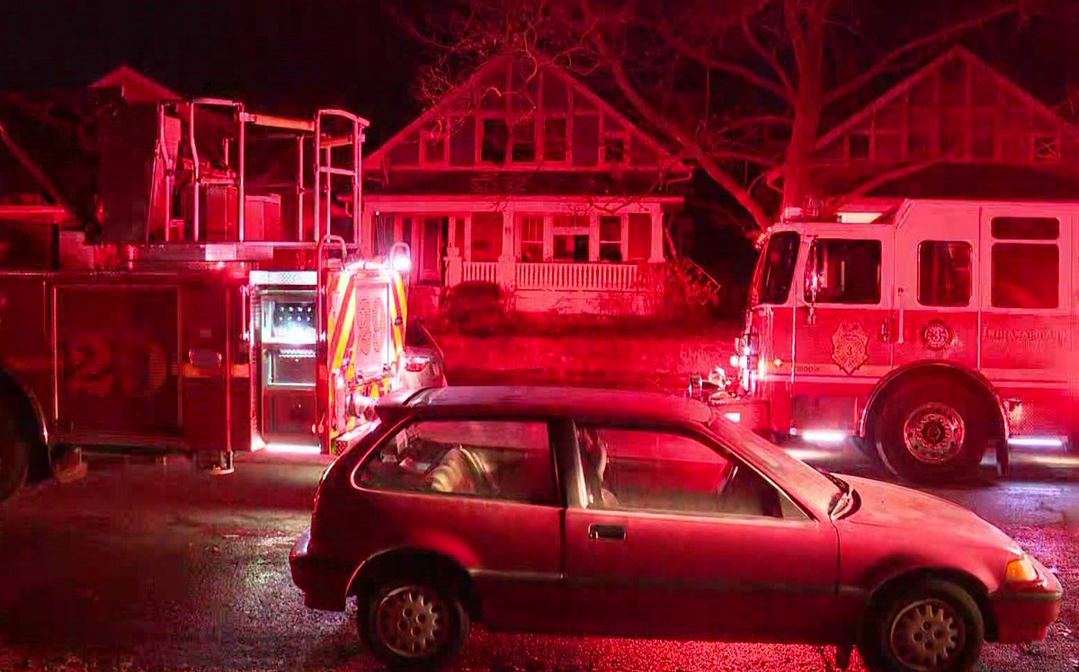 IFD crews are investigating after they saved a woman and man from the roof of a house fire on Indy's near south side this morning