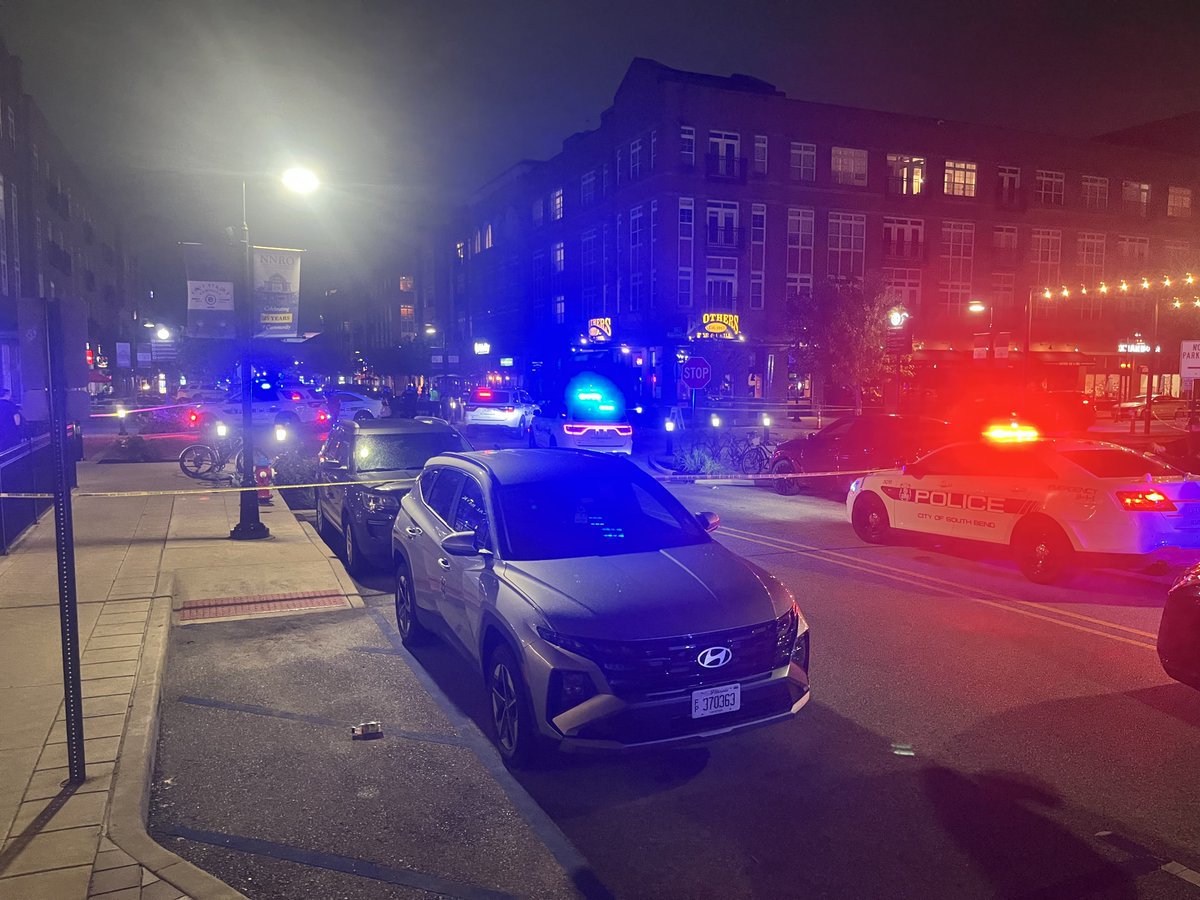 Two people, including a police officer, were injured in a shooting near Eddy Street Commons